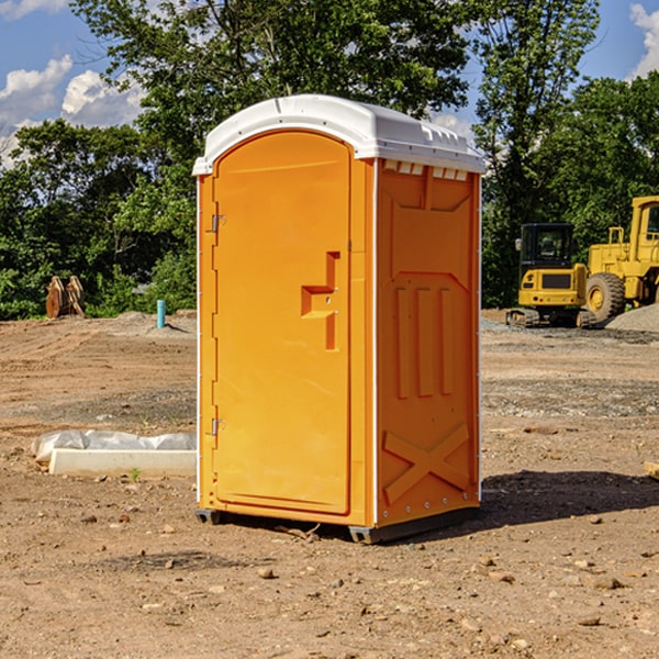 what is the cost difference between standard and deluxe portable restroom rentals in Vance